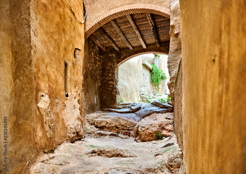 Archway in old town of Miravet Spain