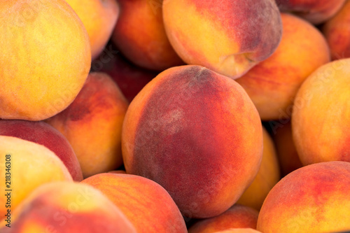 fresh ripe peaches in the box ready for sale.