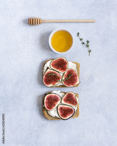 Toasted whole wheat bread with figs, ricotta (cream cheese), thyme, honey