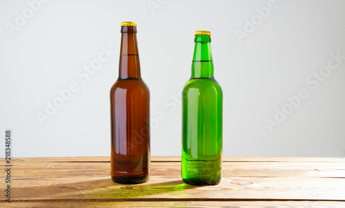 Beer bottles on a wooden table . Top view. Selective focus. Mock up. Copy space.Template. Blank.