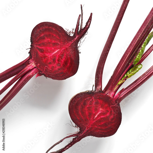 Fresh beets with tops  isolated on a white background, top view.
