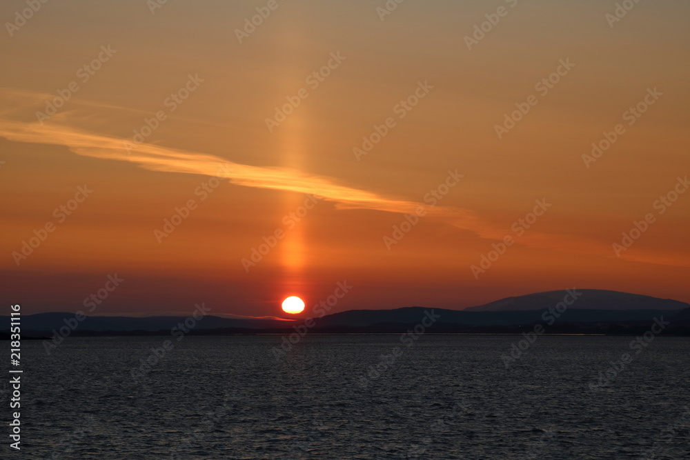 Naklejka premium Sunrise by the sea