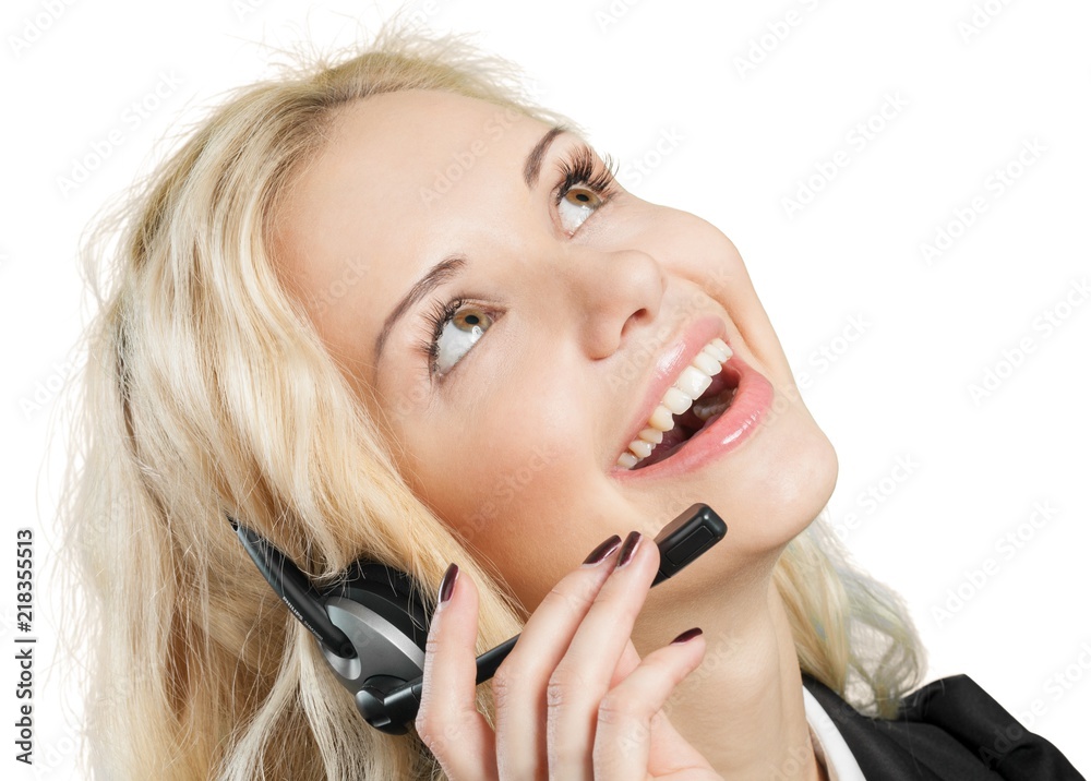 Portrait of young businesswoman with headphones smiling at