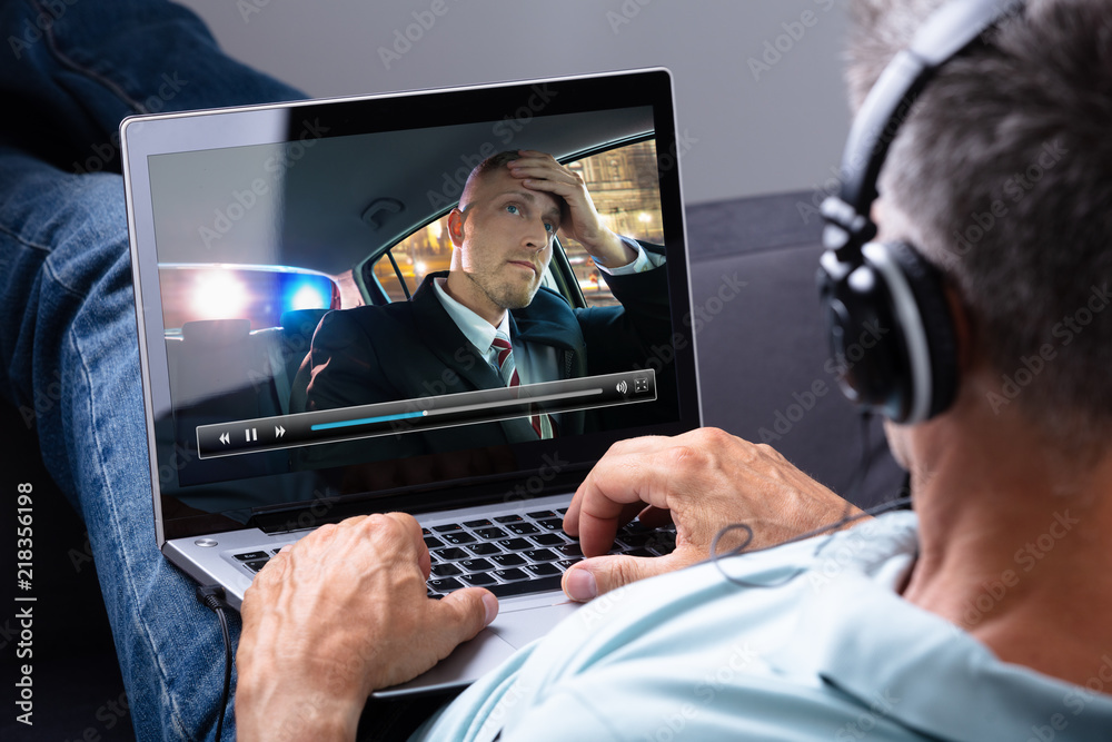 Obraz premium Relaxed Man Watching Video On Laptop