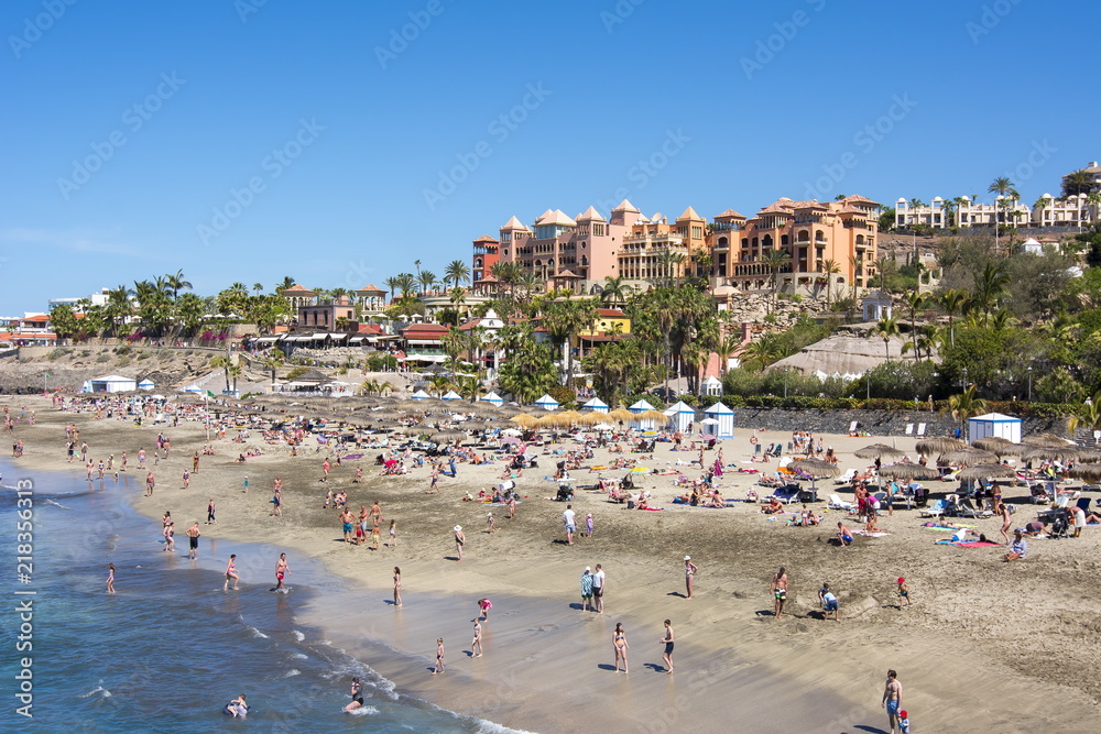 Tourists on El Duque beach in Costa Adeje, Tenerife, Spain