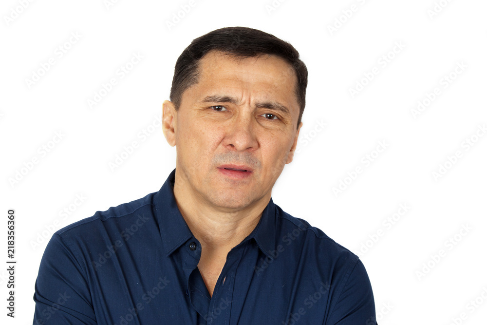 A young man looks skeptical at the interlocutor. Concept emotions skepticism A young man looks skeptical at the interlocutor. Concept emotions skepticism