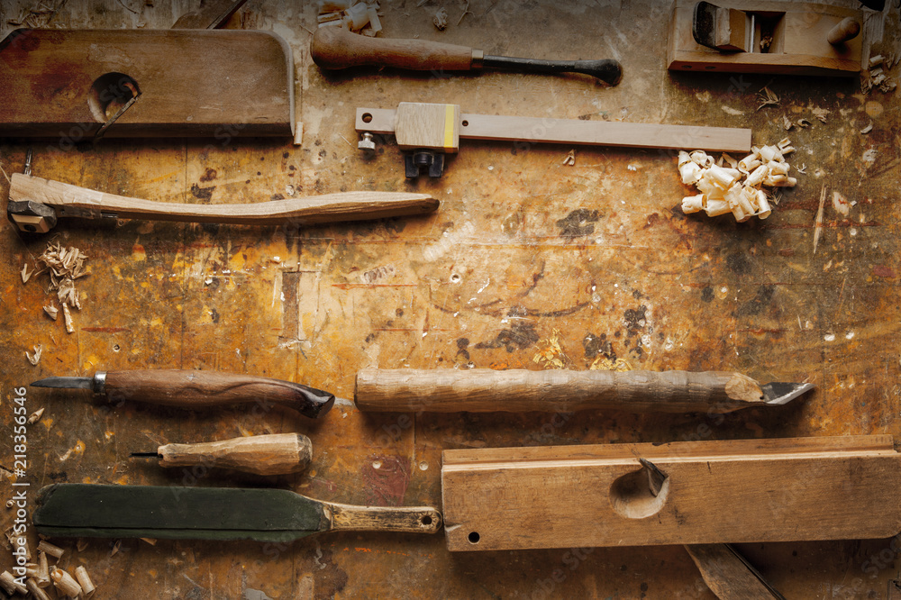 Hand tools Wood on an old wooden workbench Hand tools Wood on an old wooden workbench