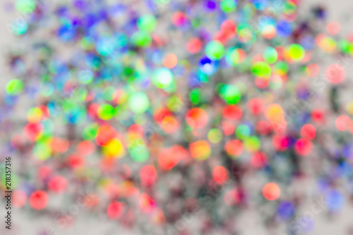 Colorful beautiful blurred bokeh background Holiday texture. Glitter multicolored light spots