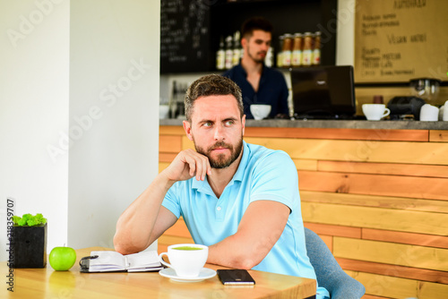 Caffeine makes you more productive. Serious guy enjoy caffeine drink close up. Start day with big cup of coffee. Increase productivity with coffee break. Man bearded dreamy face needs inspiration
