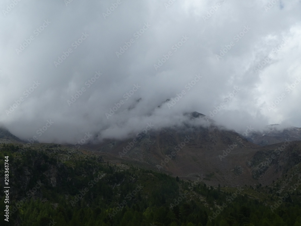 summit rock of the mountains in italy south tyrol europe in the clouds