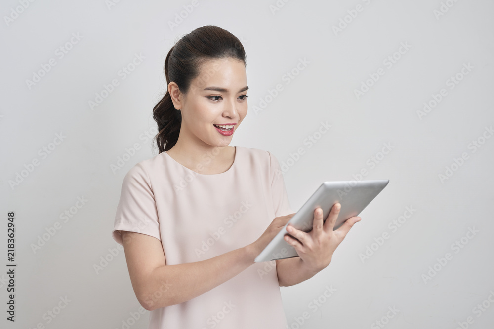 Portrait of smiling lovely business lady using digital tablet Portrait of smiling lovely business lady using digital tablet