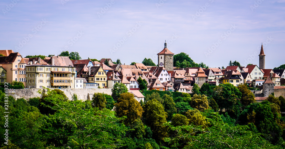 Colorful buildings of Rothenburg Ob Der Tauber in Germany. Showing timber framed and stone buildings of the whole city as well as the wall and watchtowers.