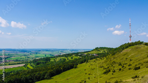 View of the top of the Hesselberg mountain in Bavaria, Germany. Taken on a sunny summer day and showing the telecommunication tower at the top and panoramic views.