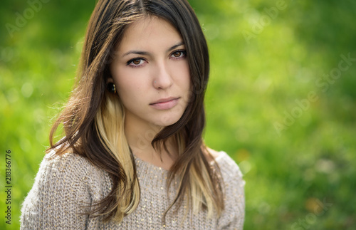 Portrait of young beautiful woman in sweater. Shallow depth of field.