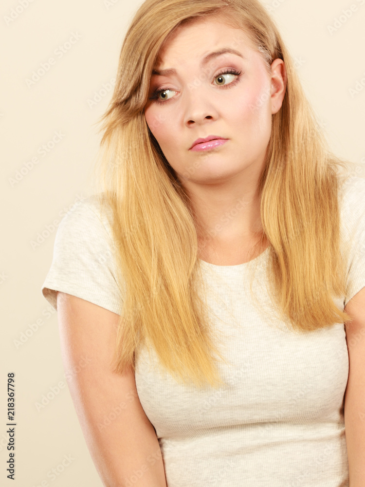 Fototapeta premium Sad cute young blonde attractive woman