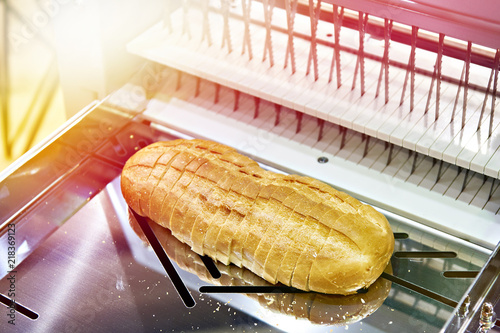 Sliced bread in cutting machine photo