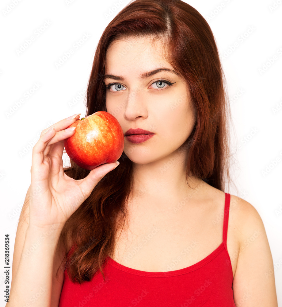 Young woman holding red apple Young woman holding red apple