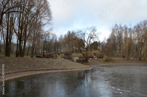 city public park near the water, late autumn frost in the city park