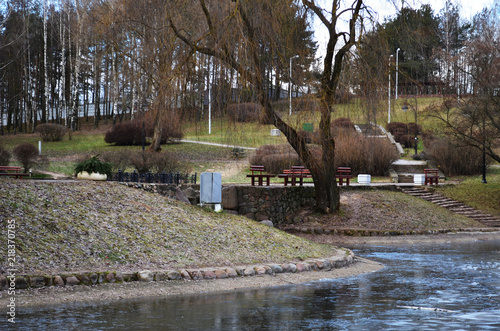 city public park near the water, late autumn frost in the city park