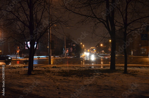 night street in the city, view of the road at night, wet asphalt, cars