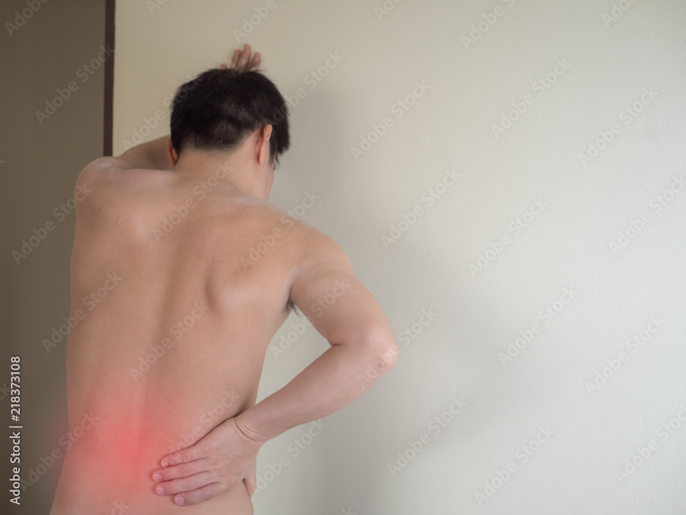 Close up of man rubbing his painful back. Pain relief, chiropractic concept. Close up of man rubbing his painful back. Pain relief, chiropractic concept.