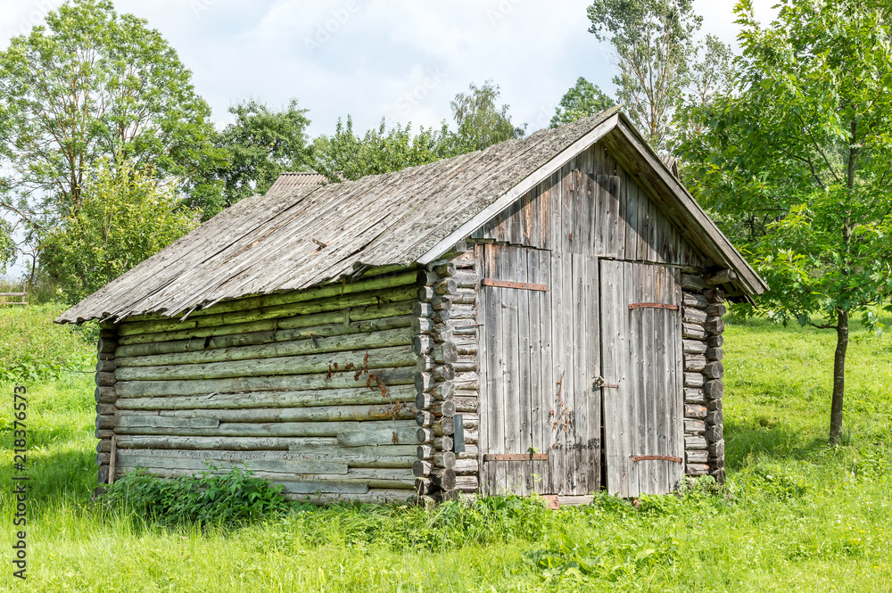 Old wooden barn in forest. Old wooden barn in forest.