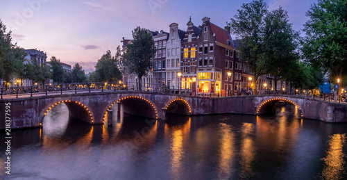 Photography Bridge over Keizersgracht - Emperor's canal in Amsterdam, The Netherlands at twilight