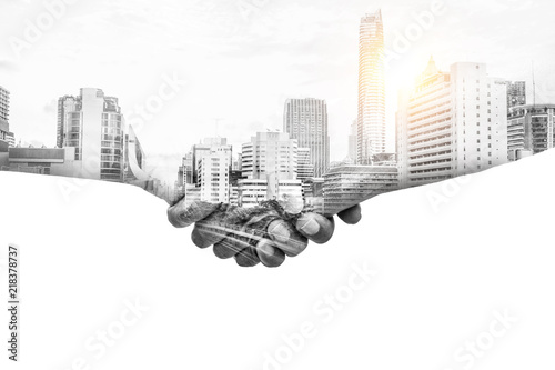 Double exposure help hands shaking together and urban city