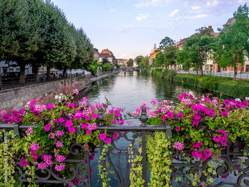Along the Ill River in Petite France areas of Strasbourg in the Alsace region of France. The homes are the traditional half timbered houses visible all over this area of France.