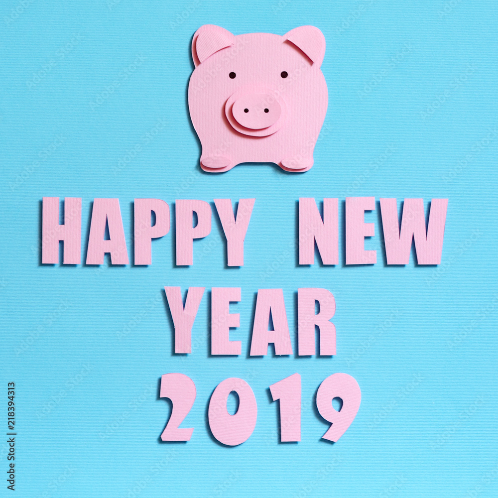 Inscription with the New Year 2019. Symbol of the year of Pig on a turquoise textured background, top view Inscription with the New Year 2019. Symbol of the year of Pig on a turquoise textured background, top view