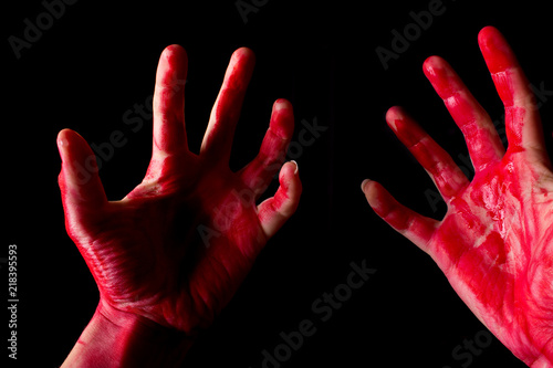 Fotografija Bloody theme lone murderer: the murderer shows bloody hands and experiencing dep