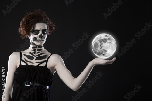 attractive woman with sugar skull make-up. Halloween