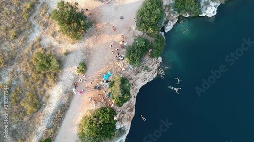 Jumping from the cliffs of Lake Zmajevo Oko photo