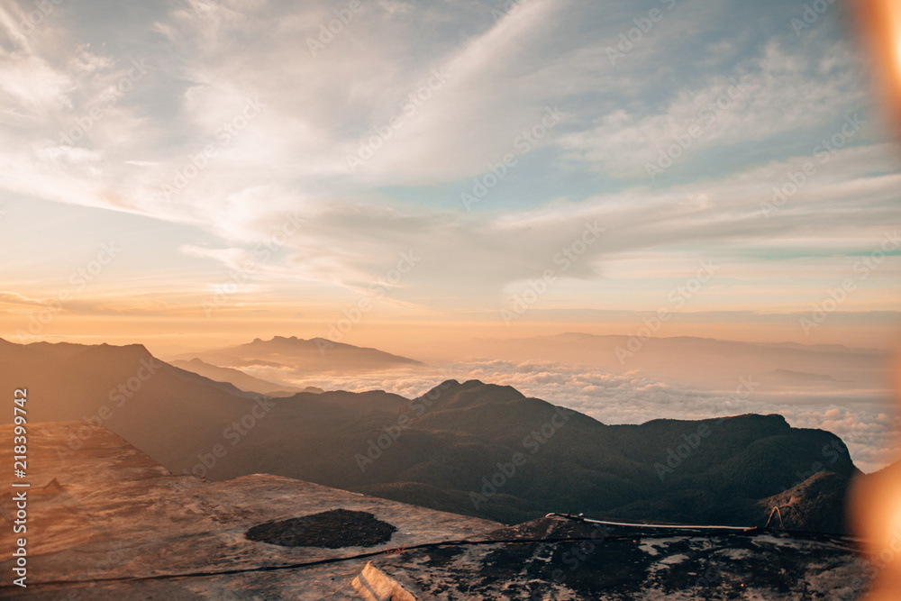 Naklejka premium sunset above mountainpeaks