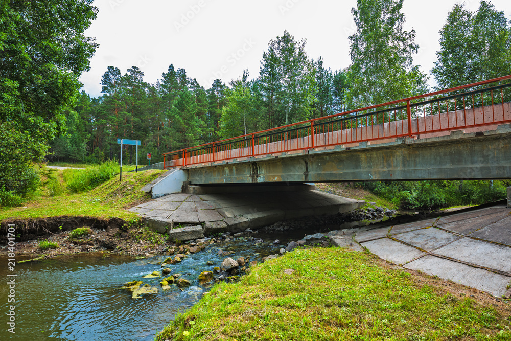 Fototapeta premium River bridge. Chingisy, Novosibirsk oblast, Russia