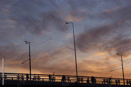 Silhouette of street lights during beautiful sunset photo