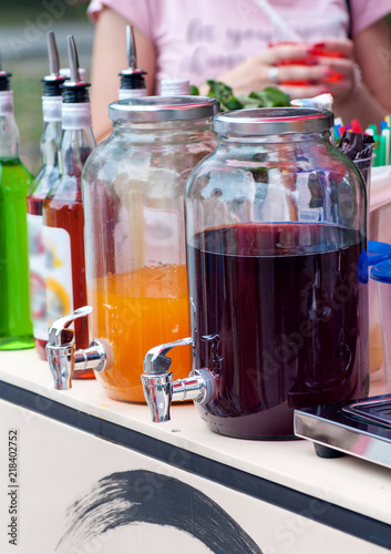 dispenser with fresh drinks on the street in hot weather