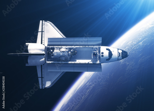 Fototapeta Naklejka Na Ścianę i Meble -  Space Shuttle Orbiter In The Rays Of Light