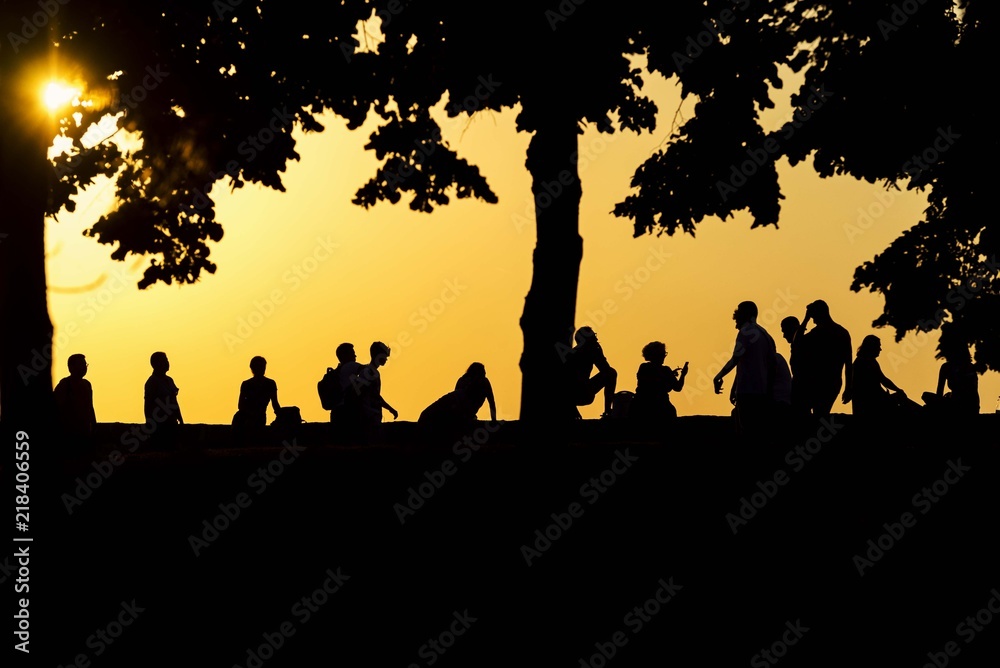 peoples silhouette on sunset