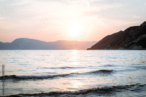 Dramatic sunrise with mist on the beach