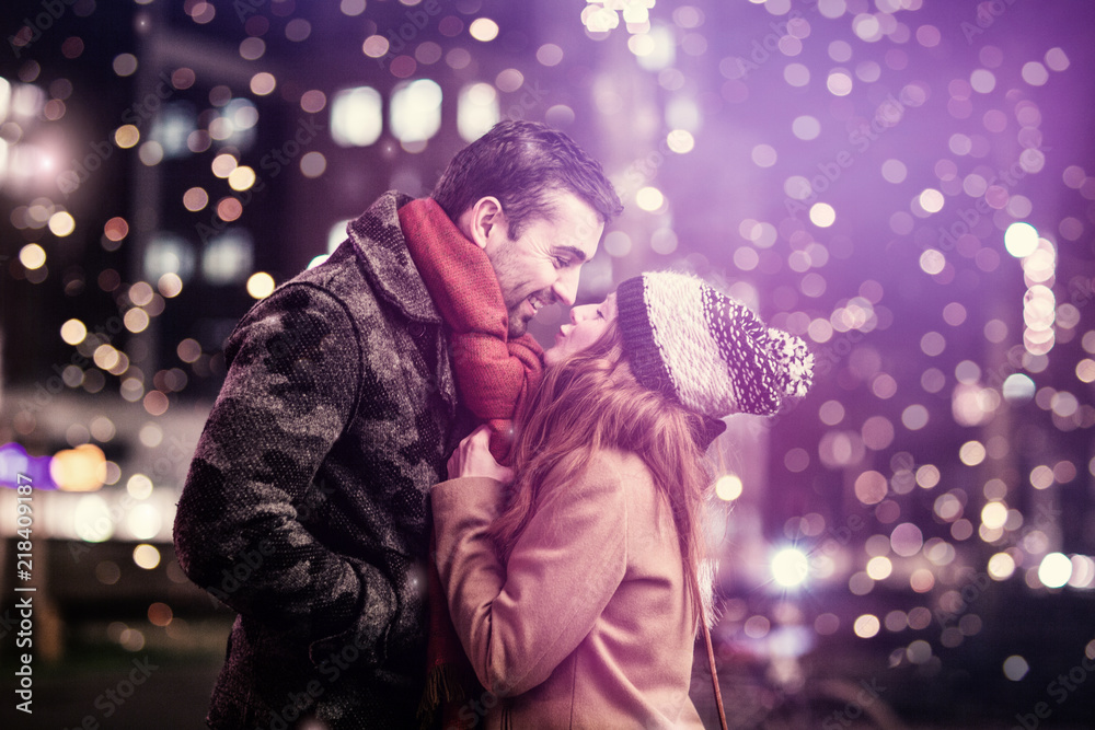 pretty young loving couple is kissing romantically at night pretty young loving couple is kissing romantically at night