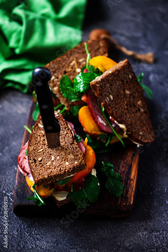 Canvas Print peach and pastrami sandwiches with peppery mayo.