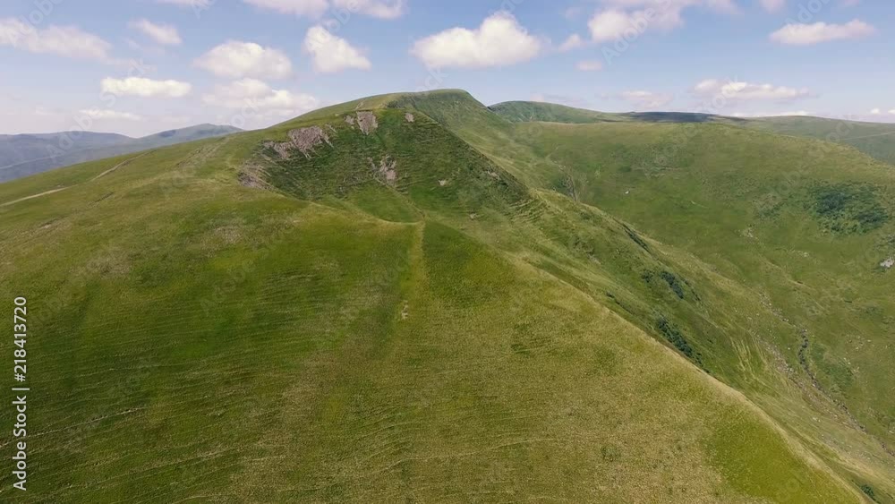 Aerial shot of a Carpathian mountain looking like a giant monster in summer Aerial shot of a Carpathian mountain looking like a giant monster in summer