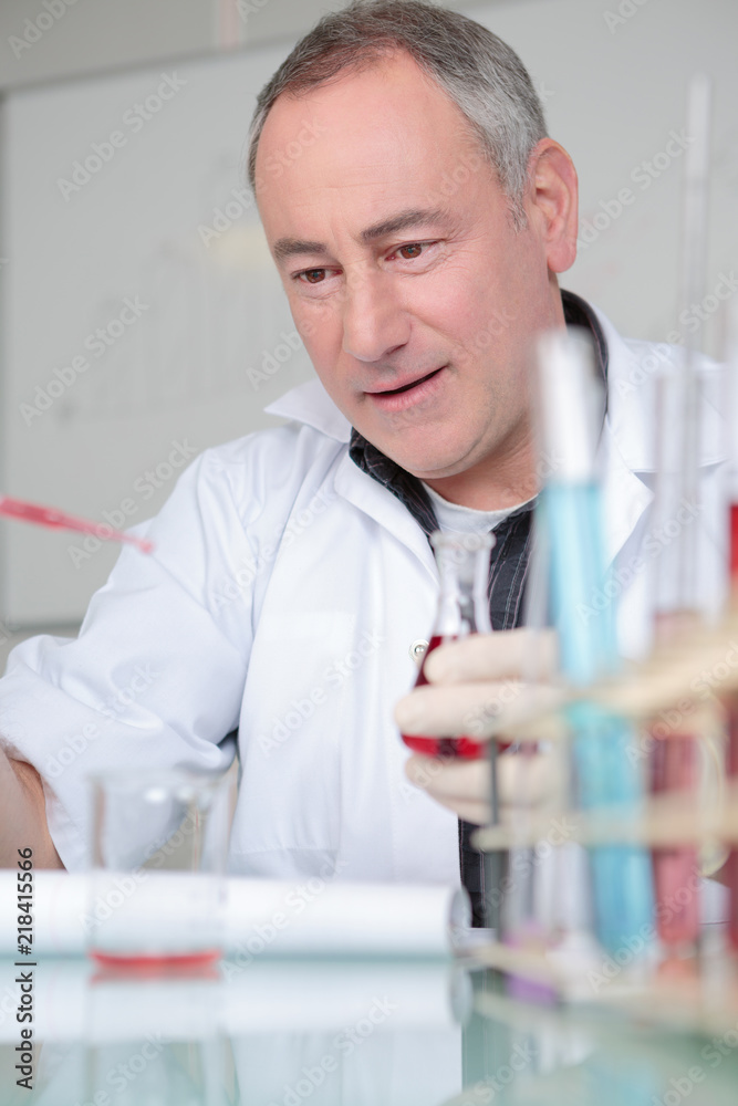 scientist mixing reagents making test or research in clinical laboratory scientist mixing reagents making test or research in clinical laboratory