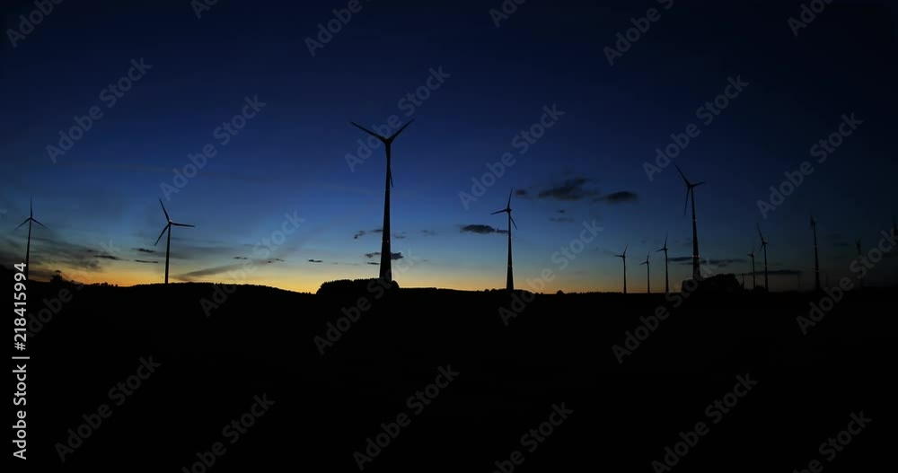 renewable energy: power generating wind turbines in the countryside