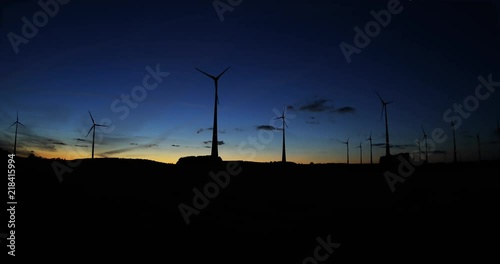 renewable energy: power generating wind turbines in the countryside