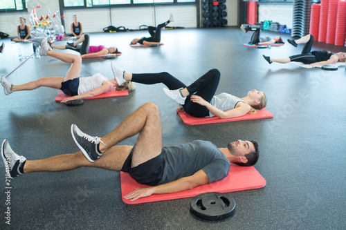 people training in fitness club