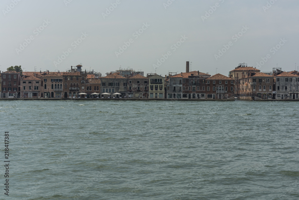 Venice city view from the sea. Local famous architecture.