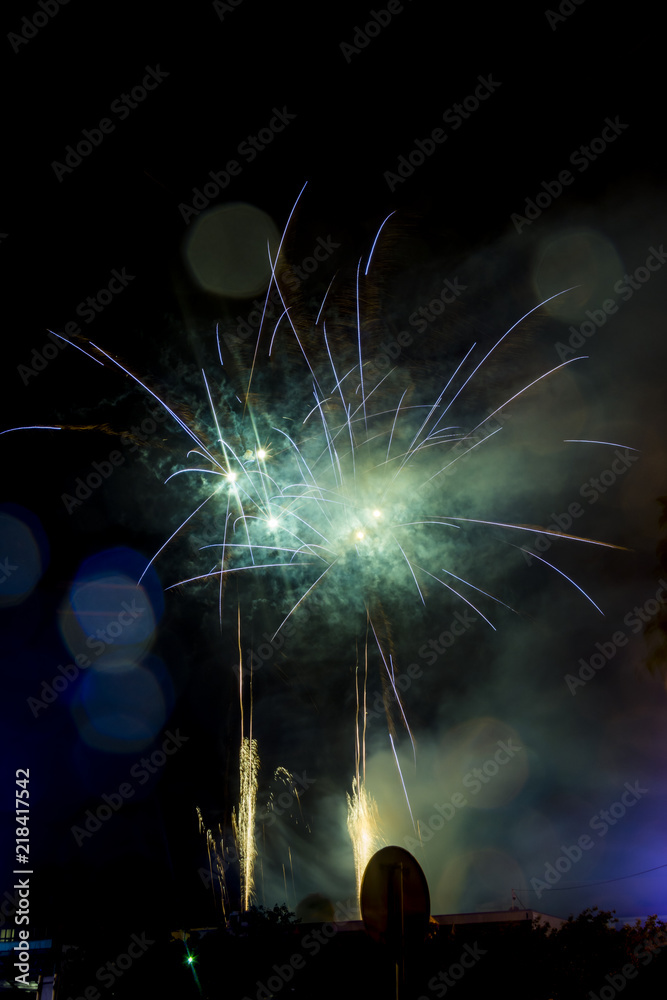 Green and blue firework. Amazing fireworks with bokeh from drops on the lens, fireworks 2019, fireworks background, fireworks event, Celebration in the town. Green and blue firework. Amazing fireworks with bokeh from drops on the lens, fireworks 2019, fireworks background, fireworks event, Celebration in the town.