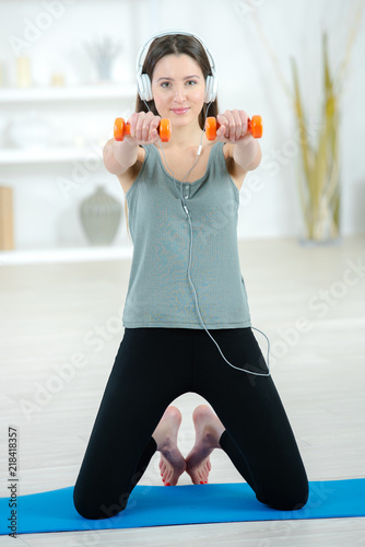 Woman working out at home © auremar